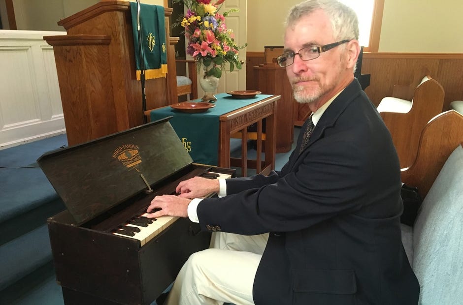 Laurel Hill Presbyterian Church organist Leon Curenton Jr. sits at the church's newly restored 1927 Bilhorn Bros. Style V pump organ. [Brian Hughes | Special to the News Bulletin]