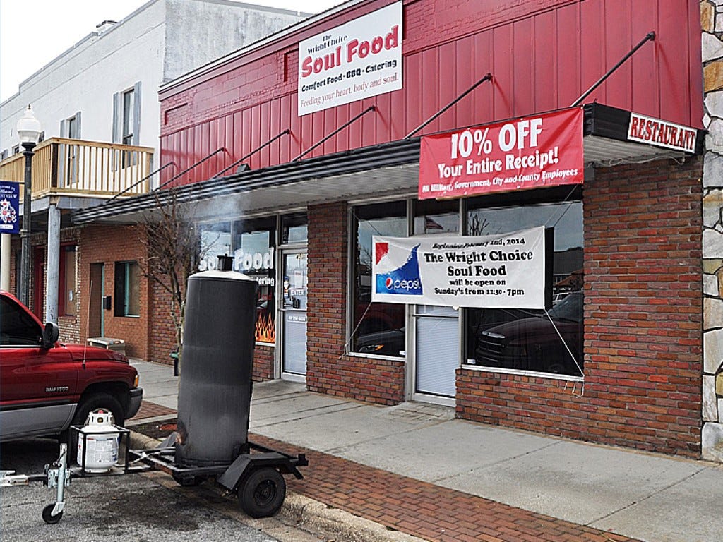Wright Choice Soul Food’s smoker, seen in this February photo, once served as a landmark for the restaurant. Since then, city officials required owner Albert Wright to move it behind the establishment.