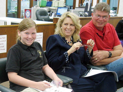 Taylor Smith, 9 — with grandparents Cindi and Greg Smith — filled in a child's ballot for favorite food, toy, cartoon dog and movie while waiting for general election results Tuesday at the Okaloosa Supervisor of Elections office.
