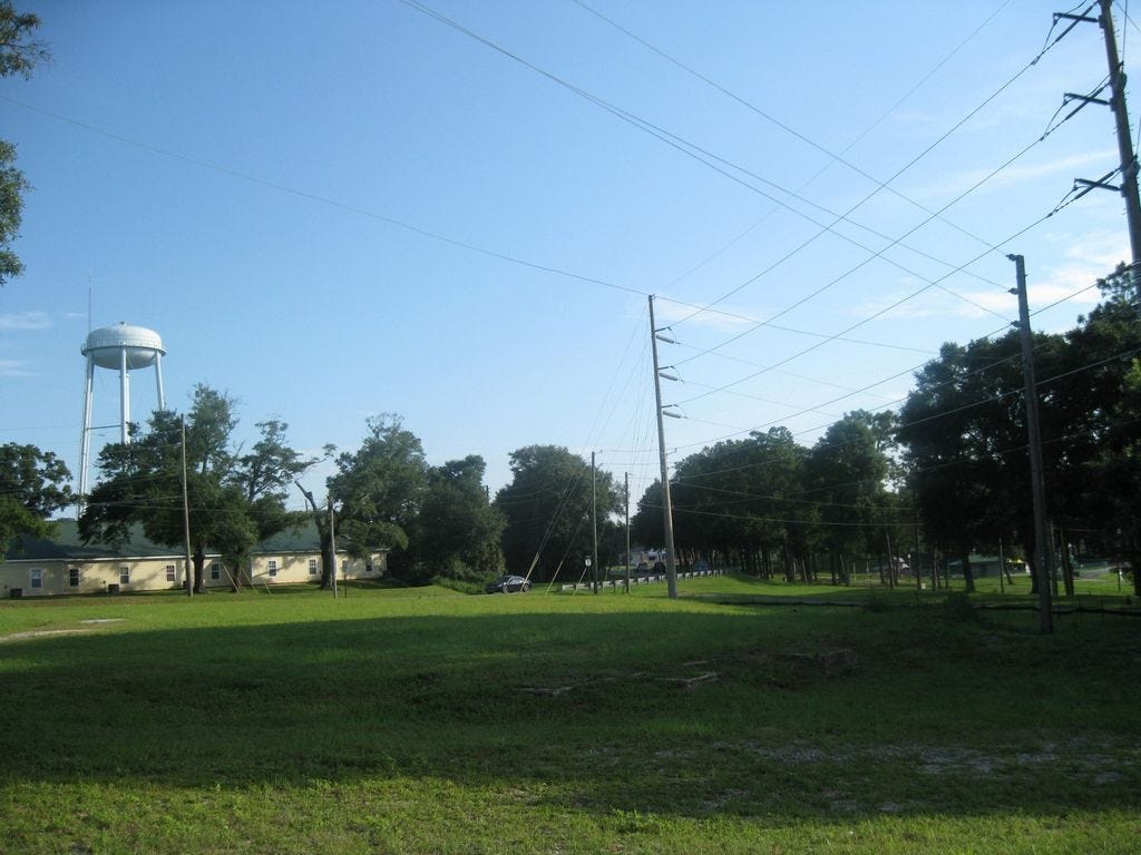 This former transformer site was on the Environmental Protection Agency's “Superfund” clean-up list for mercury contamination. Now cleaned up, it may become a parking lot for Twin Hills Park, seen in the right background.