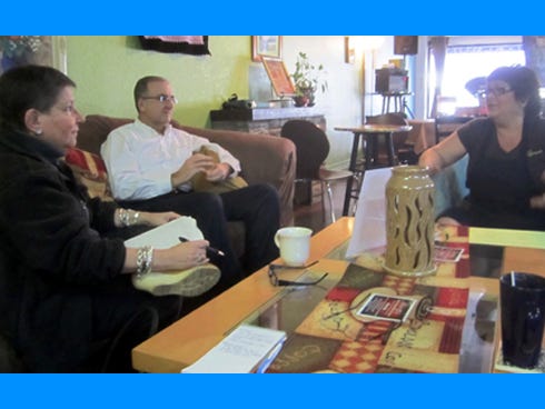 Crestview Area Chamber of Commerce Arts and Culture Committee members Rae Schwartz, Paul Lowrey and Sandra Peters discuss plans over coffee at Journey Java Connection.
