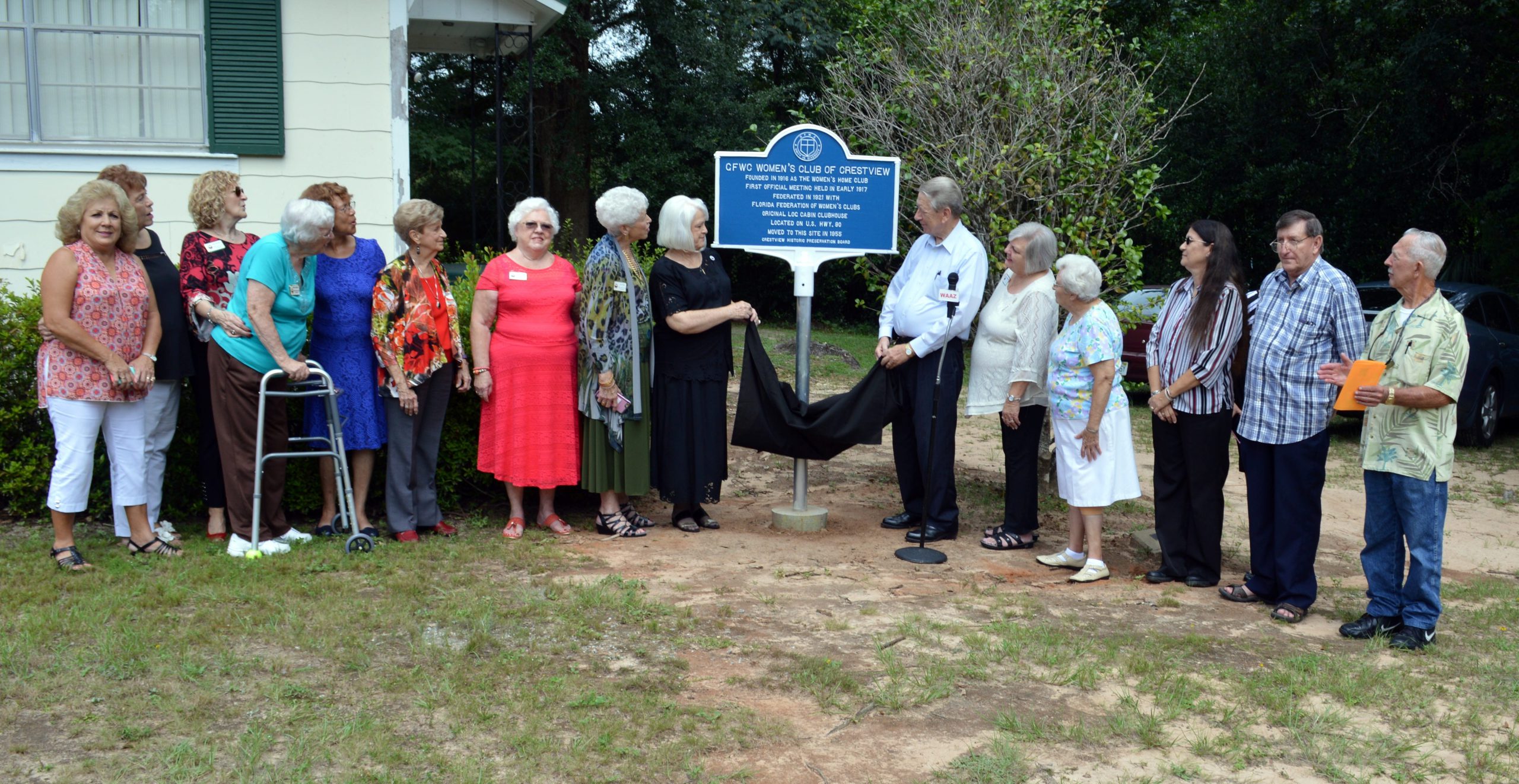 Members of the Crestview Women's Club and the Crestview Historic Preservation Board look on as the marker is unveiled. [Baker Block Museum | Special to the News Bulletin]