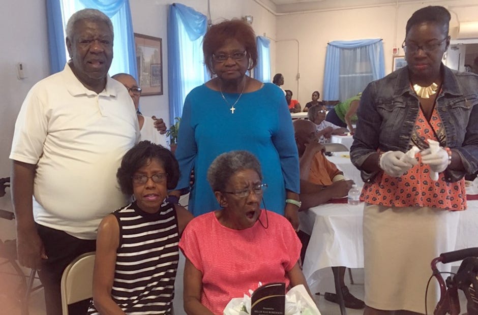 The Concerned Citizens Group of Crestview presented member and local resident Rae Roberson with an award "to show her how much we appreciated all she's done for us," a CCGC spokesperson said. Roberson (front row, right) is shown with some of her family members and friends. [Jean Bell | Special to the News Bulletin]