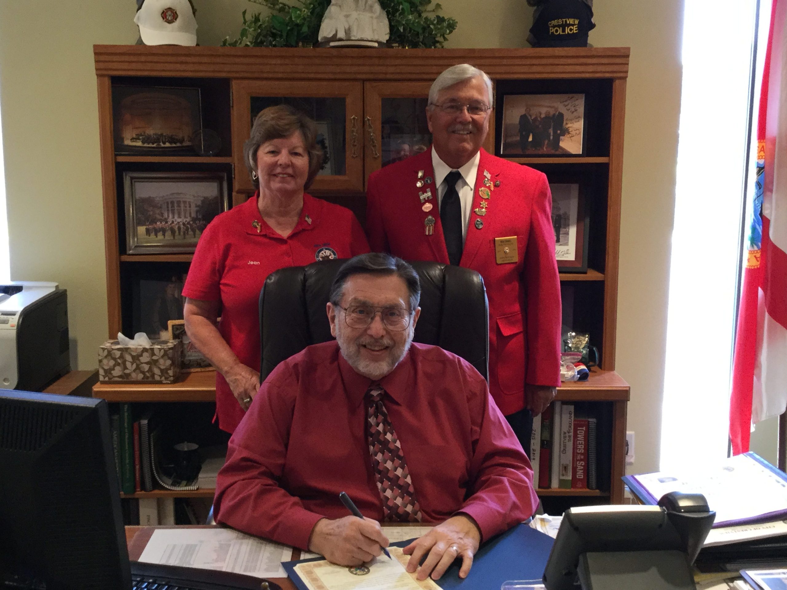 Crestview Mayor David Cadle signs a proclamation recognizing Sept. 11-17 as National Patriotism Week. [Special to the News Bulletin]