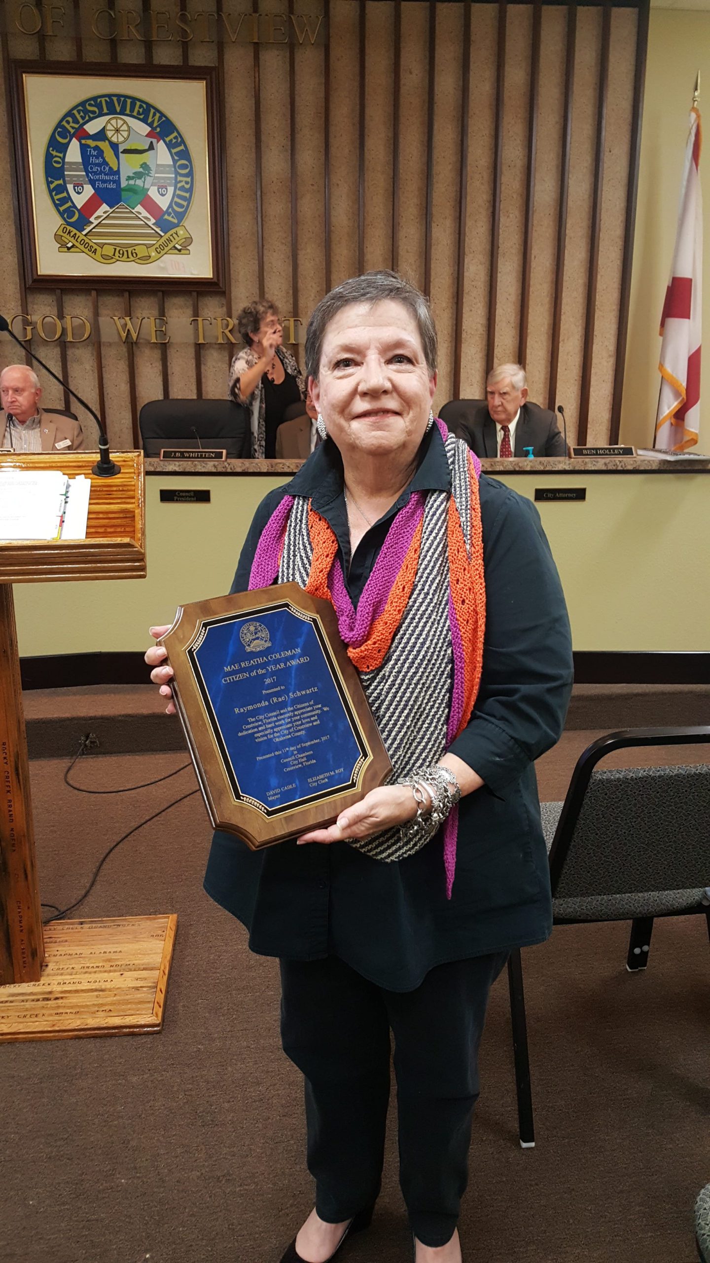 Rae Schwartz smiles with her Citizen of the Year plaque awarded to her by the Citizen of the Year Committee and Mayor David Cadle. [ALICIA ADAMS | News Bulletin]