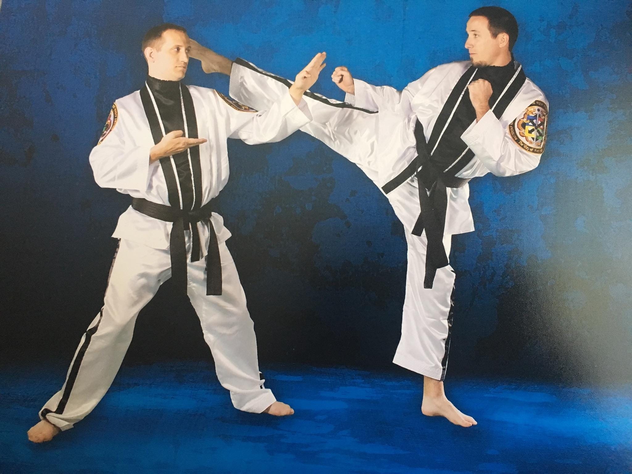 Nathan Carroll (left) and Paul Carroll (right) have been involved in martial arts training for more than 20 years. Now, they are both master taekwondo instructors. [Special to the News Bulletin]