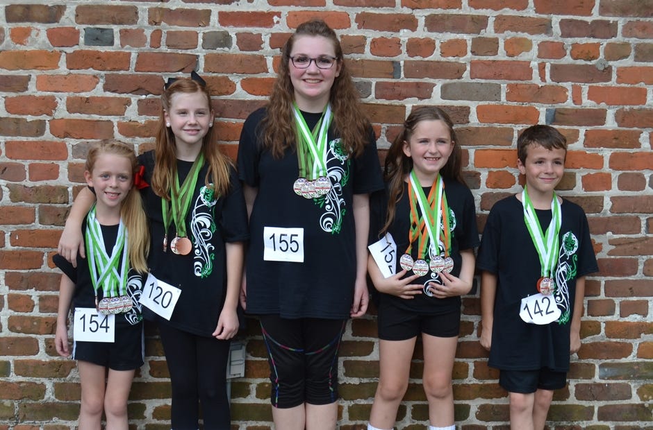 Jane Taylor, Piper Hall, Rachael Bell, Kaylyn Converse and Logan Schulte (from left) won 10 first-place awards and several others after competing in an Irish dance competition Sept. 16 in Louisiana. [Special to the News Bulletin]