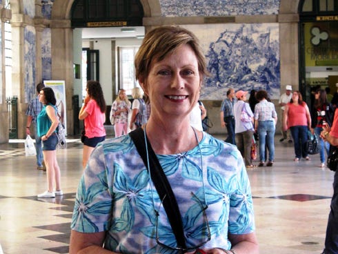 University of Florida Institute of Food and Agricultural Sciences Extension agent Elaine Courtney — pausing in Porto, Portugal's central train station, during a 2013 trip through the Iberian Peninsula — says that taking public transportation is one way to maximize vacation dollars.