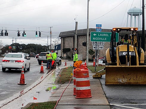Panhandle Paving and Grading workers Tuesday morning start construction on a turn lane. The addition will let up to 30 cars line up in front of the Crestview courthouse to turn right onto State Road 85.
