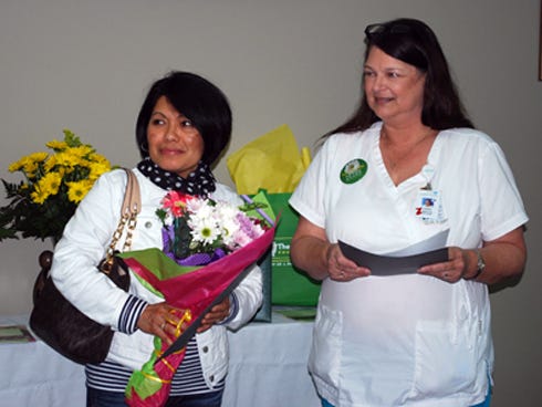 Caring Hands Award Winner: From left are Caring Hands Award recipient CNA Dee Wells and Carrie Bryant, RN - nursing director, Step Down Unit.