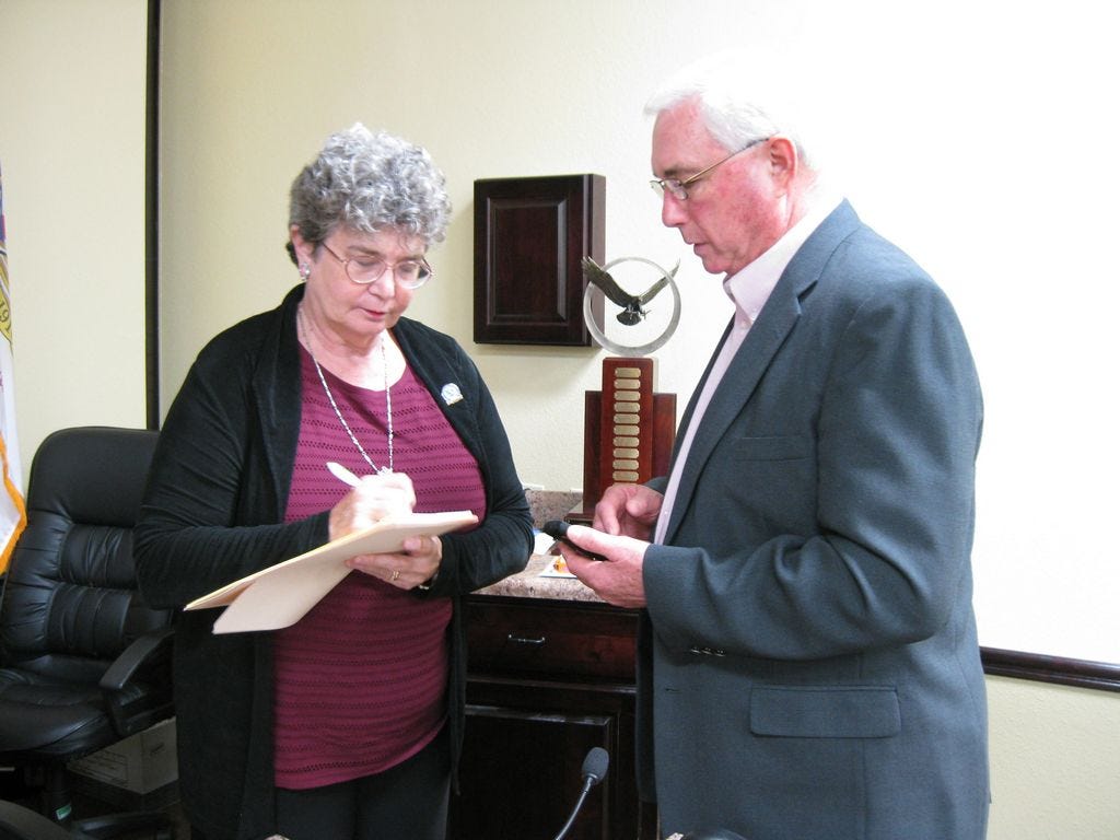 Councilman-select Doug Faircloth meets with City Clerk Betsy Roy following his appointment to the council seat vacated in August by Mickey Rytman.