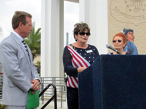 Daughters of the American Revolution Choctawhatchee Bay Chapter members Joyce Harrington and Patti Cogdal recognize Marcus J. Michles II, of the Michles Family Freedom Foundation, for his outstanding volunteer efforts. Pictured beside him during an April 11 ceremony are Cogdal, Flag Committee chairman, and Harrington, chaplain.