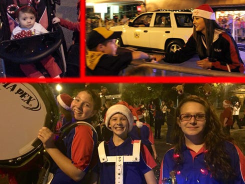 Left: Makenna Rossiter, topped with a decorative candy cane hair band, watches from her stroller. Right: Crestview High School varsity cheerleader Victoria Fader passes by parade-goers on Main Street. Bottom: Shoal River Middle School band students Grace Weeks, Braden Majors and Aniston Woolfe wear smiles in downtown Crestview.