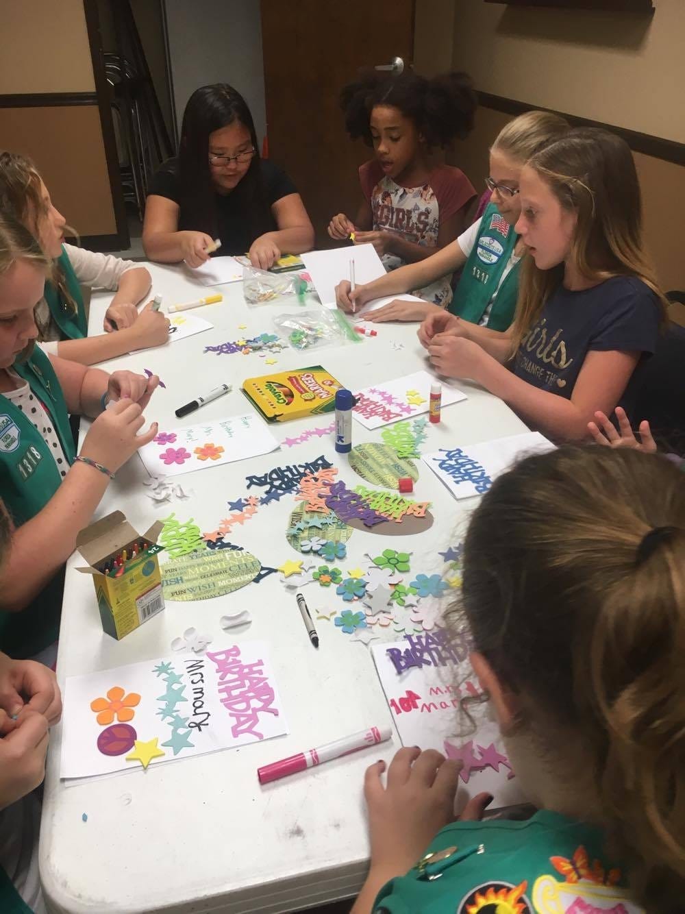 Crestview Girl Scout Troop 1318 members decorate birthday cards for Mary Richardson, a Crestview Rehabilitation Center resident. [SPECIAL TO THE NEWS BULLETIN]