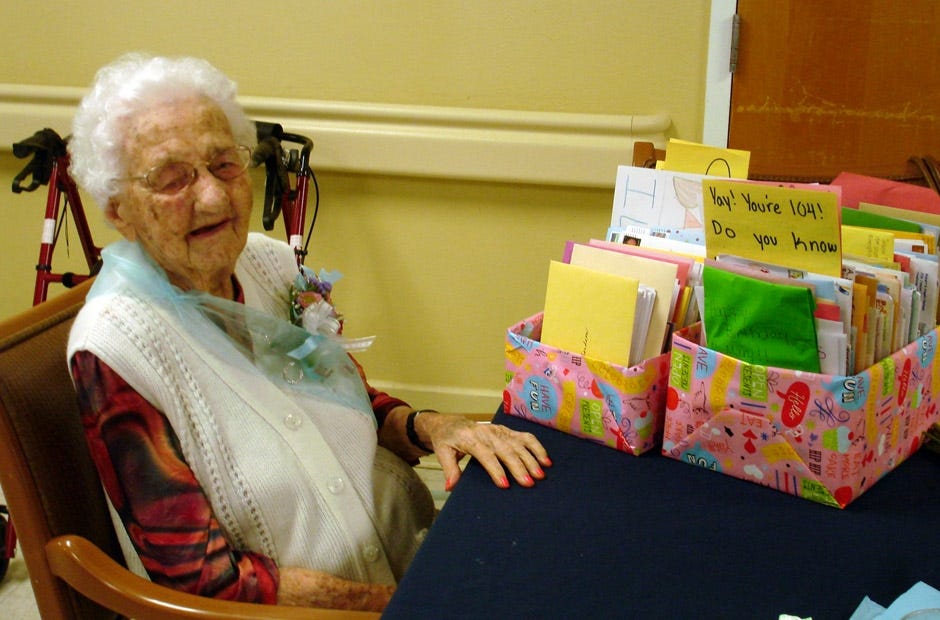 Mary Richardson, 104, posed for a phopto with some of the birthday cards she received from well-wishers. [RENEE BELL | NEWS BULLETIN]