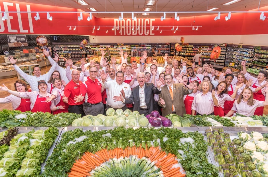 Winn-Dixie employees and officials celebrate the remodel of the local store Oct. 12 in Crestview. [SPECIAL TO THE NEWS BULLETIN]