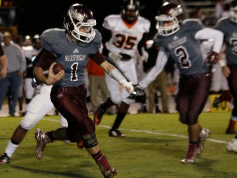 Austin Davis, seen here carrying the ball for Baker against Graceville in the opening round of the playoffs, scored two touchdowns in Friday's win over Vernon in the Region 1-1A final.