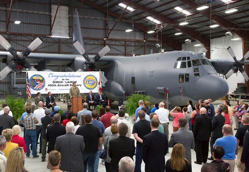Employees celebrate their 400th consecutive build of a self-protected aircraft system recently in Crestview. Every delivery has been on time, making U.S. Air Force warfighters' ability "better equipped to perform their mission and have a system that provides superior protection to both aircraft and aircrews."