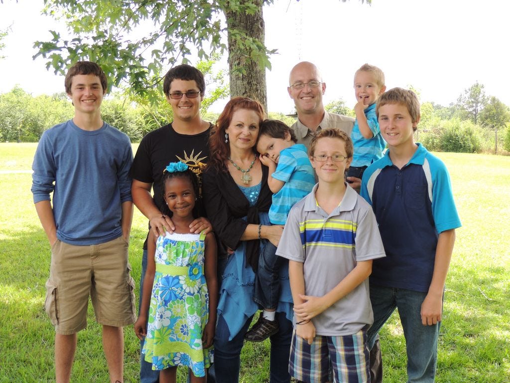 The Stapp family, from left, is Alec, 18; Wil, 20; Eliana Nigist, 7; mom Mary; Gabriel, 5; dad Joe; Isaac, 13 (wearing glasses); Elijah, 3; and Josh, 15.