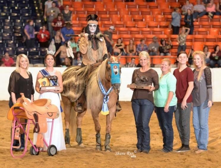 Angie Reichert and the horse she rode, Surely Cashing Chex, in the competition stand with other attendees. [SHANE RUX PHOTOGRAPHY | SPECIAL TO THE NEWS BULLETIN]