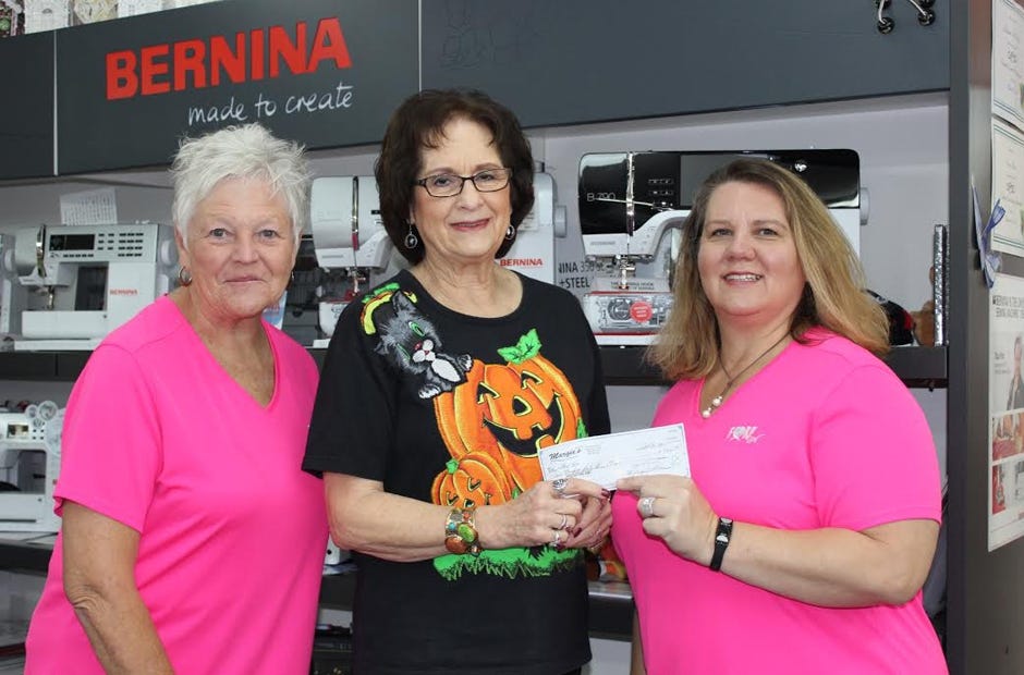 Fore Her representatives accepted a donation of over $543 from Margie Greene (center), owner of Margie's Sew Much Fun. FH Patient Liaison Ginny Richerson is on the left, and FH founder Amy Walsh is at right. [SPECIAL TO THE NEWS BULLETIN]