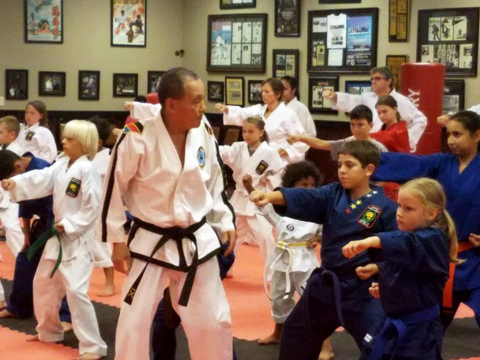 Taekwon-Do Grand Master KS Hwang instructs younger students during a recent Gordon Martial Arts seminar in Crestview. [SPECIAL TO THE NEWS BULLETIN]