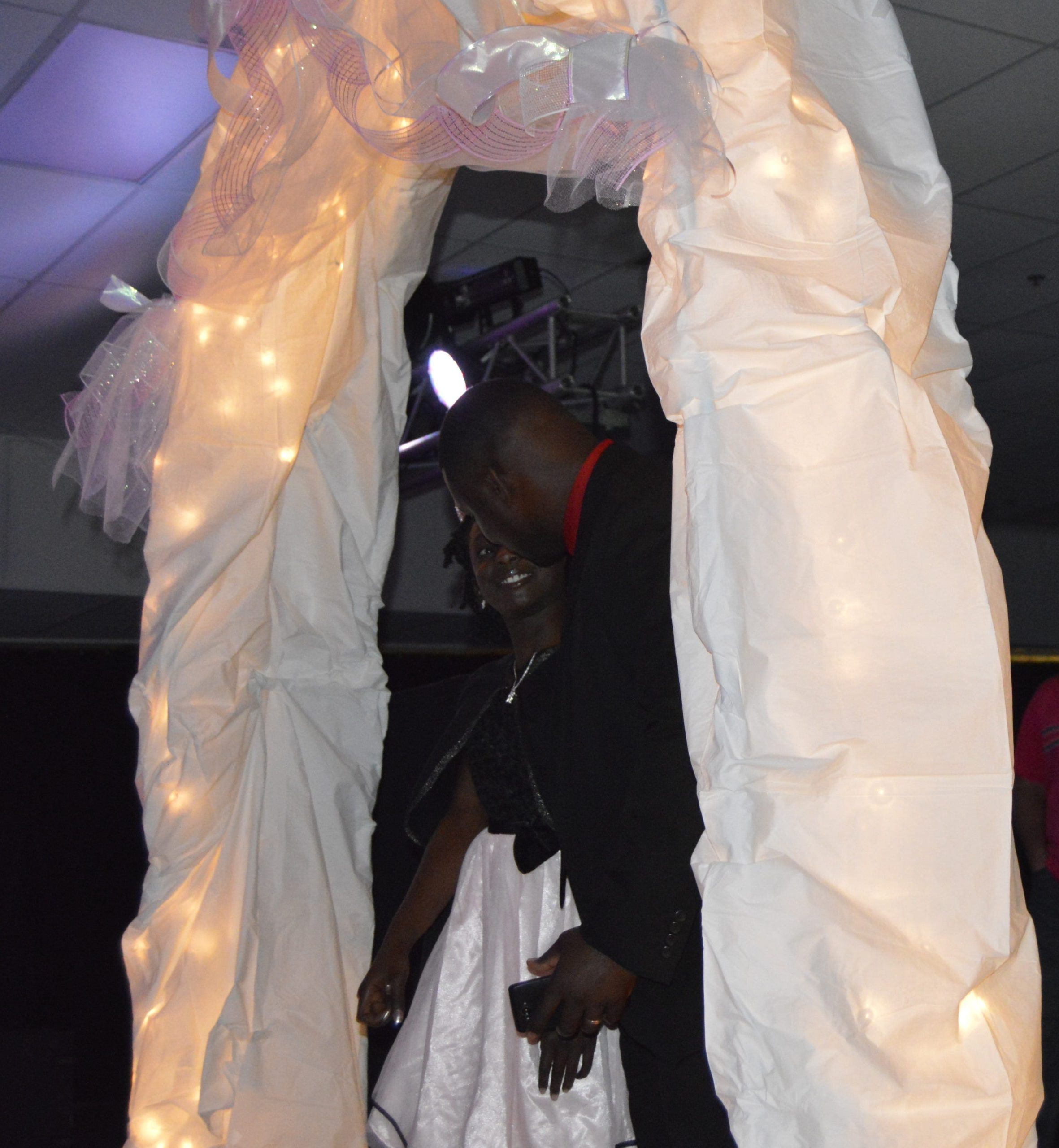 Moniya Harris is surprised by her father, Jermaine Harris, at the Crestview Relay For Life Princess Ball. [ALICIA ADAMS | News Bulletin]