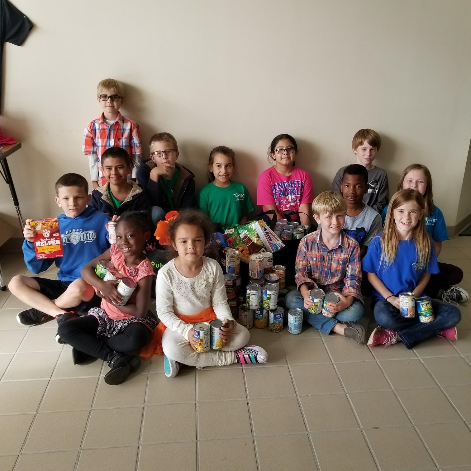 Throughout October students from Rocky Bayou Christian School’s Crestview campus collected 800 canned goods and other items for the Central Food Pantry. The facility provides food and other services for Crestview families in need. Pictured with some of the collected items are, back row, left to right: Jere Martin, Alex Winkler, Hailey Vasquez, Bella Farran and Aaron Griffin. Middle row, left to right, are Landen Weeks, Nicholas Batteas, Lincoln Albritton and Krystal Mercer. Front row are Laila Scott, Silvia Poremski, Beau Boyles and Ava Cantrell. [Special to the News Bulletin]