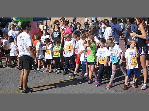 Families gather at the starting line for the Kids 5K race.