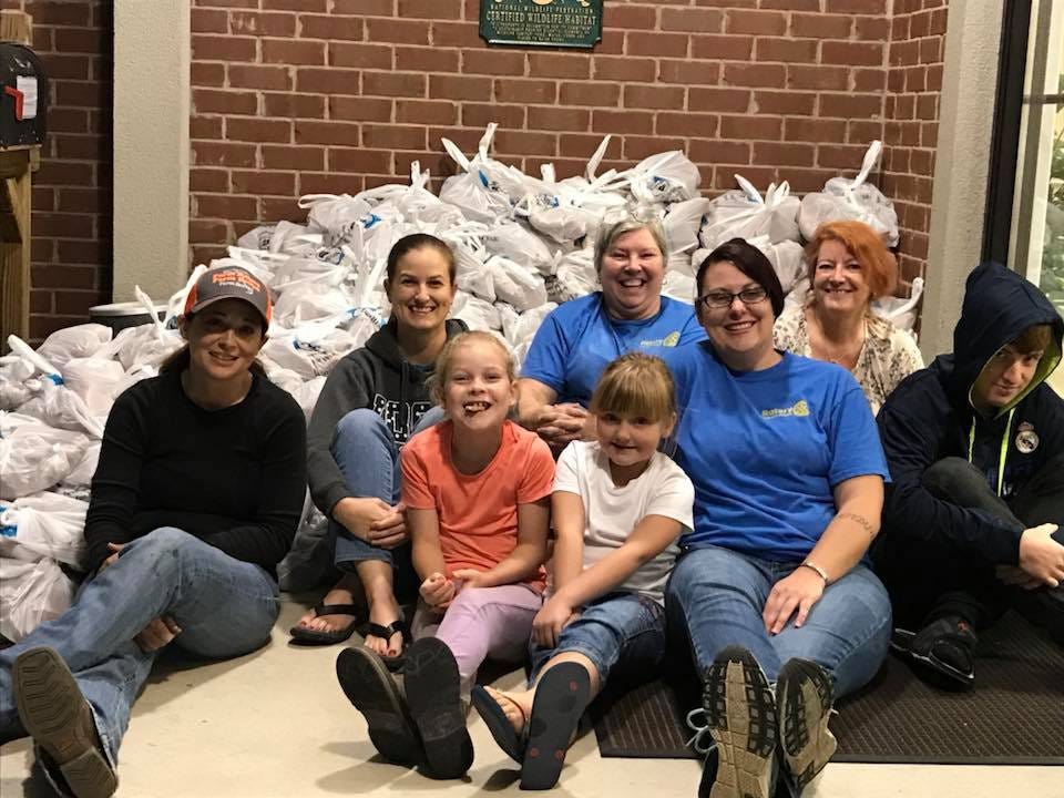 Volunteers from the Crestview Rotary Club bagged grits, cornmeal and sweet potatoes for the Farm-City Week Food Distribution. [SPECIAL TO THE NEWS BULLETIN]