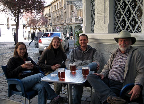 The Dreaden family — from left, Kim, Sandra, Cody and Art — relax with refreshments in the Barrio de Paris Londres district of Santiago, Chile, at the start of their pilgrimage.