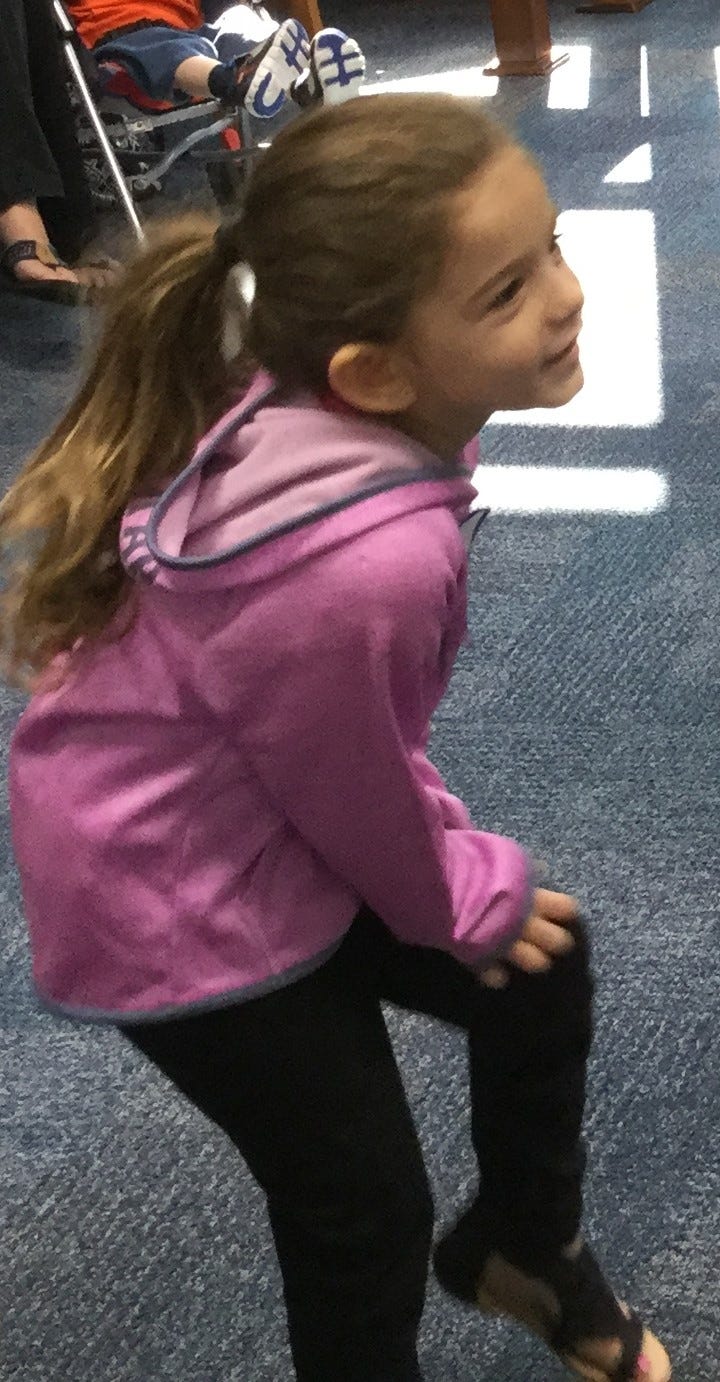 Karlie Sanchez, 4, of Crestview, pretends to scratch (wool pajamas are itchy) while everyone sings “She’ll Be Coming ’Round the Mountain,” Laurie Berkner style, during a recent class at the Crestview Public Library. [Special to the News Bulletin]