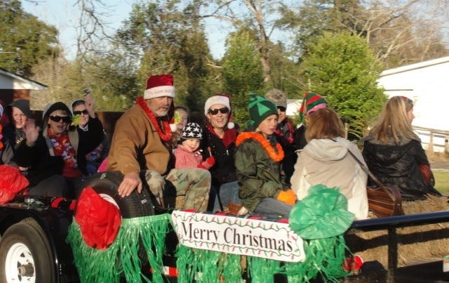 This Christmas Parade float bears a seasonal greeting, "Merry Christmas." [SAMANTHA LAMBERT | News Bulletin]