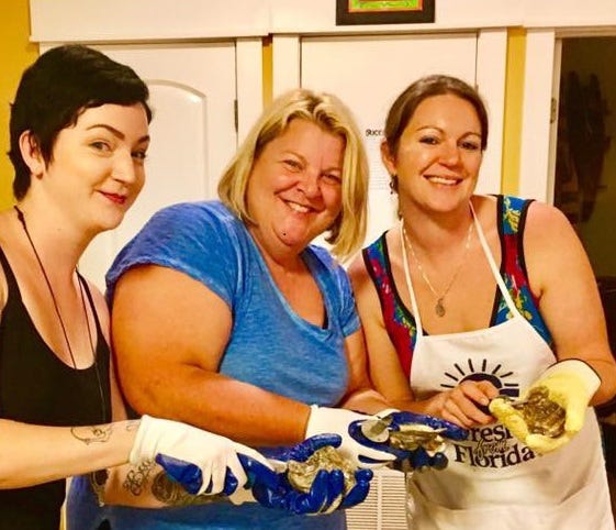 Laura Tiu (center) recommends oysters for use in stuffings and other dishes for the holidays. [SPECIAL TO THE NEWS BULLETIN]