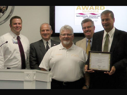 Okaloosa County has been recognized for successfully starting the STEMI program. From left are Kevin Burton, Emergency Medical Services coordinator, and Mitch Mongell, CEO, Fort Walton Beach Medical Center; Al Herndon, Okaloosa County EMS division chief; Jeff McInnis, Fort Walton Beach Medical Center board president; and Dino Villani, Okaloosa County Public Safety director.