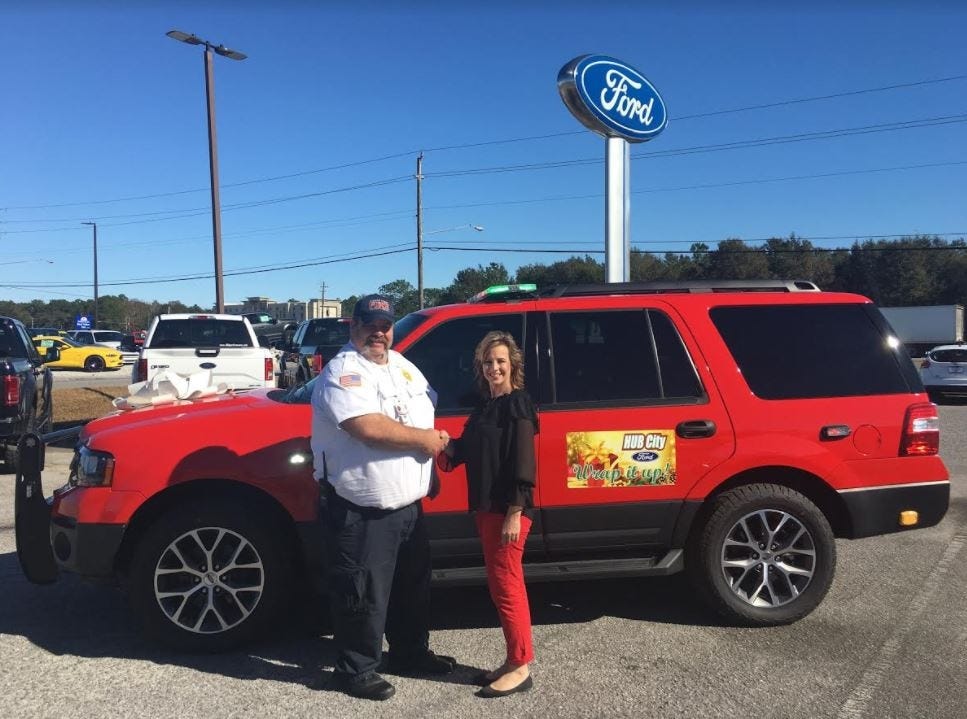 Crestview Fire Chief Tony Holland purchases a 2017 Ford Expedition at Hub City Ford. The automobile dealer provided funds for the purchase. [Special to the News Bulletin]