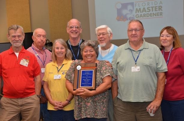 Pictured, from left, are Bob Bayer, Dave Gordon, Karen Harper, Scott Berry, The Compost Pile Editor Margaret Stewart, Ed Smith, Lee Vanderpool and Alene Ogle. [Special to the News Bulletin]