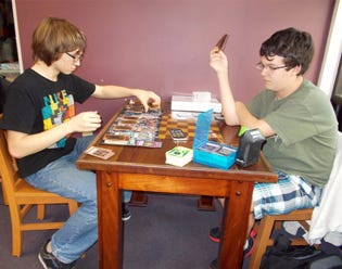 Walker Tavis and Tyler Vance play Yu-Gi-Oh! at the Crestview Public Library.