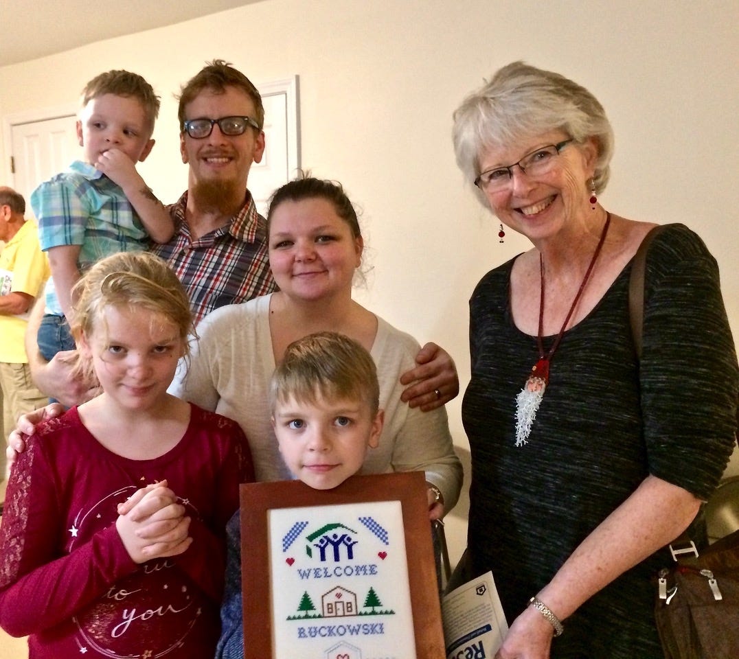 In December, Habitat for Humanity of Okaloosa County celebrated its 59th home dedication ceremony, this time benefiting the Ruckowski family in Crestview. Pictured on the far right, Barbara Harrison, Outreach chair for the Sand Dunes Chapter of the Embroiderers’ Guild of America, presents the family with a “Welcome" sampler stitched by Kimberly Mortimer and framed by Cynthia Hardesty, both chapter members. The Sand Dunes group meets 1:30-4:30 p.m. on the second and fourth Sundays at Holy Name of Jesus Catholic Church in Niceville. [Special to the News Bulletin]