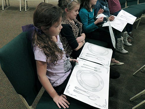 Young ladies from 2014’s Distinguished Young Woman Boot Camp enjoy a lesson in table setting and etiquette. Registration is open for this year's event.