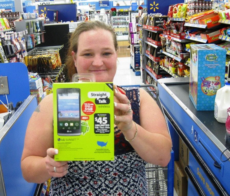 Angela Frame displays a cell phone she found for her son's Christmas present. Frame avoided the Crestview Wal-Mart's Thanksgiving day specials to shop on a peaceful Black Friday morning.