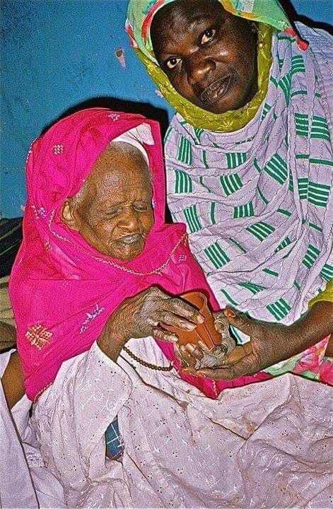Jimby Fall, left, of Senegal, West Africa, is pictured with her daughter and caretaker (name not available) in 2004. Retired chef James Wallman stayed with Fall, who was 112 years old at the time, learning about their food and culture. He's now studying Northwest Florida residents' food and culture. [JAMES WALLMAN | SPECIAL TO THE NEWS BULLETIN]