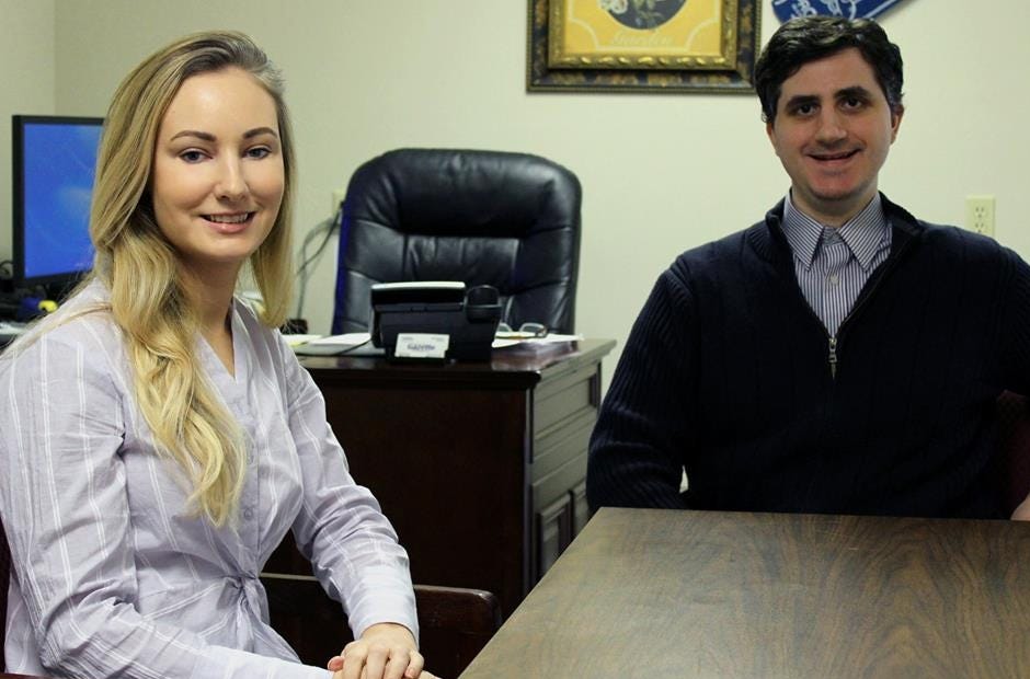 Reporter Caitlin Randle sits in the News Bulletin conference room with Editor Thomas Boni on Wednesday in Crestview. [RENEE BELL | NEWS BULLETIN]