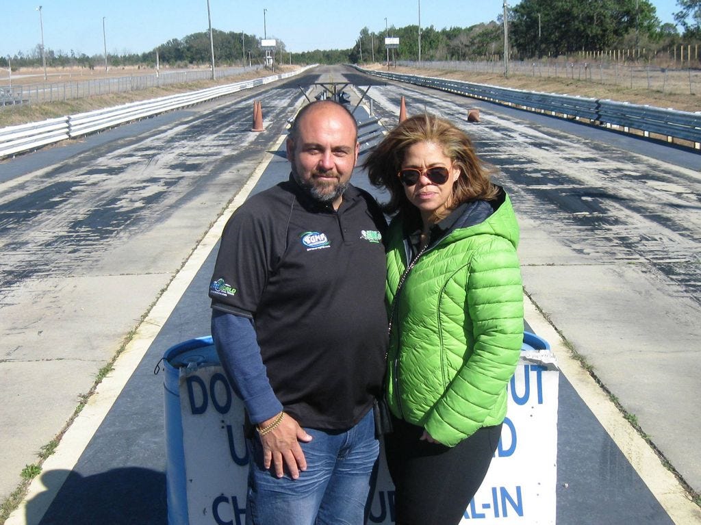 Ozzy and Marie Moya, two owners of the Emerald Coast Dragway near Holt, pose on the track in February, shortly after acquiring the property. Rehabilitation of the racetrack and its facilities, which could open in August, is ongoing.