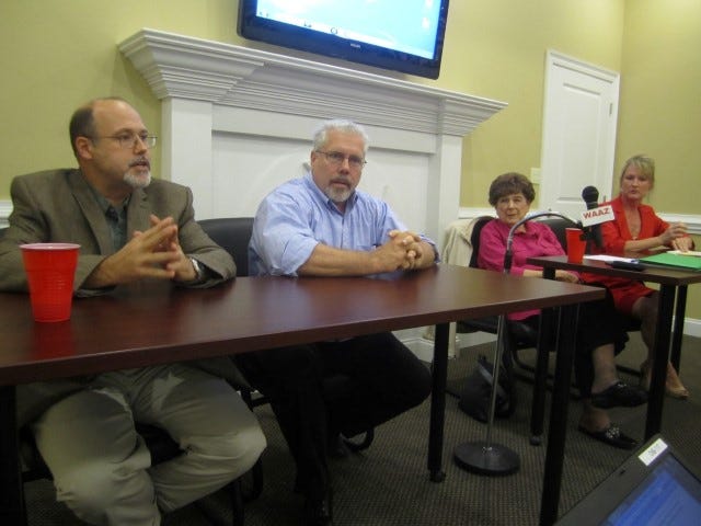 Panelists Eric Davis, Elliott Kampert, Pat Hollarn and Kay Rasmussen mull the benefits of establishing a tax increment financing district to fund the P.J. Adams-Antioch Road corridor.