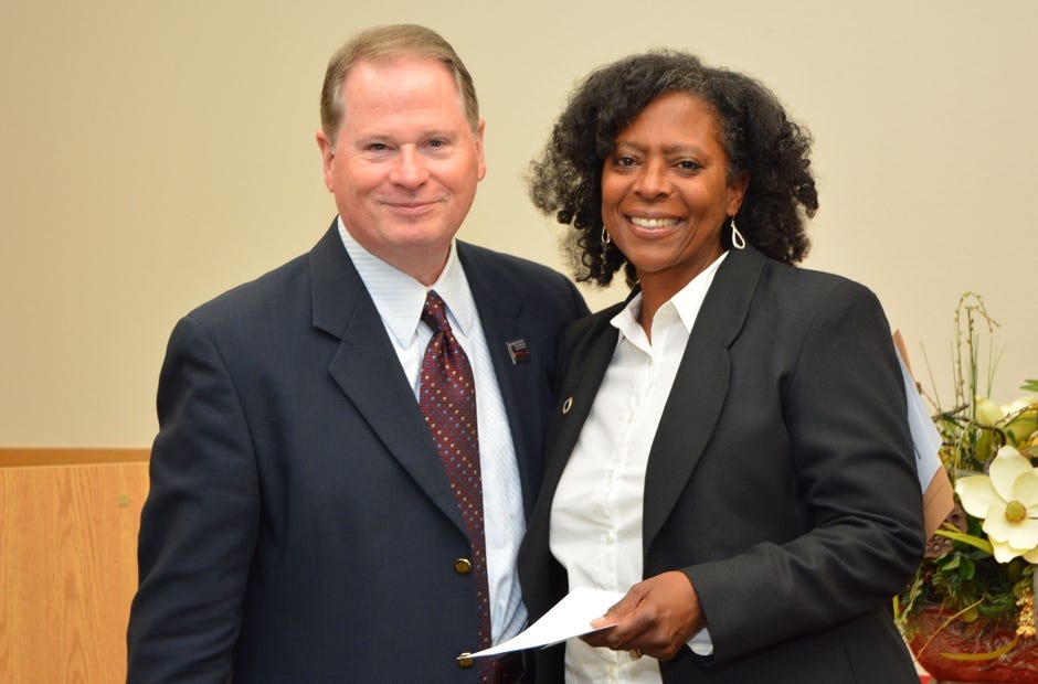 Tawanda Brown, right, is pictured with Devin Stephenson, president of Northwest Florida State College, after accepting the 2018 Terri Lynne Lokoff/Childrenís Tylenol National Child Care Teacher Award. [SPECIAL TO THE NEWS BULLETIN]