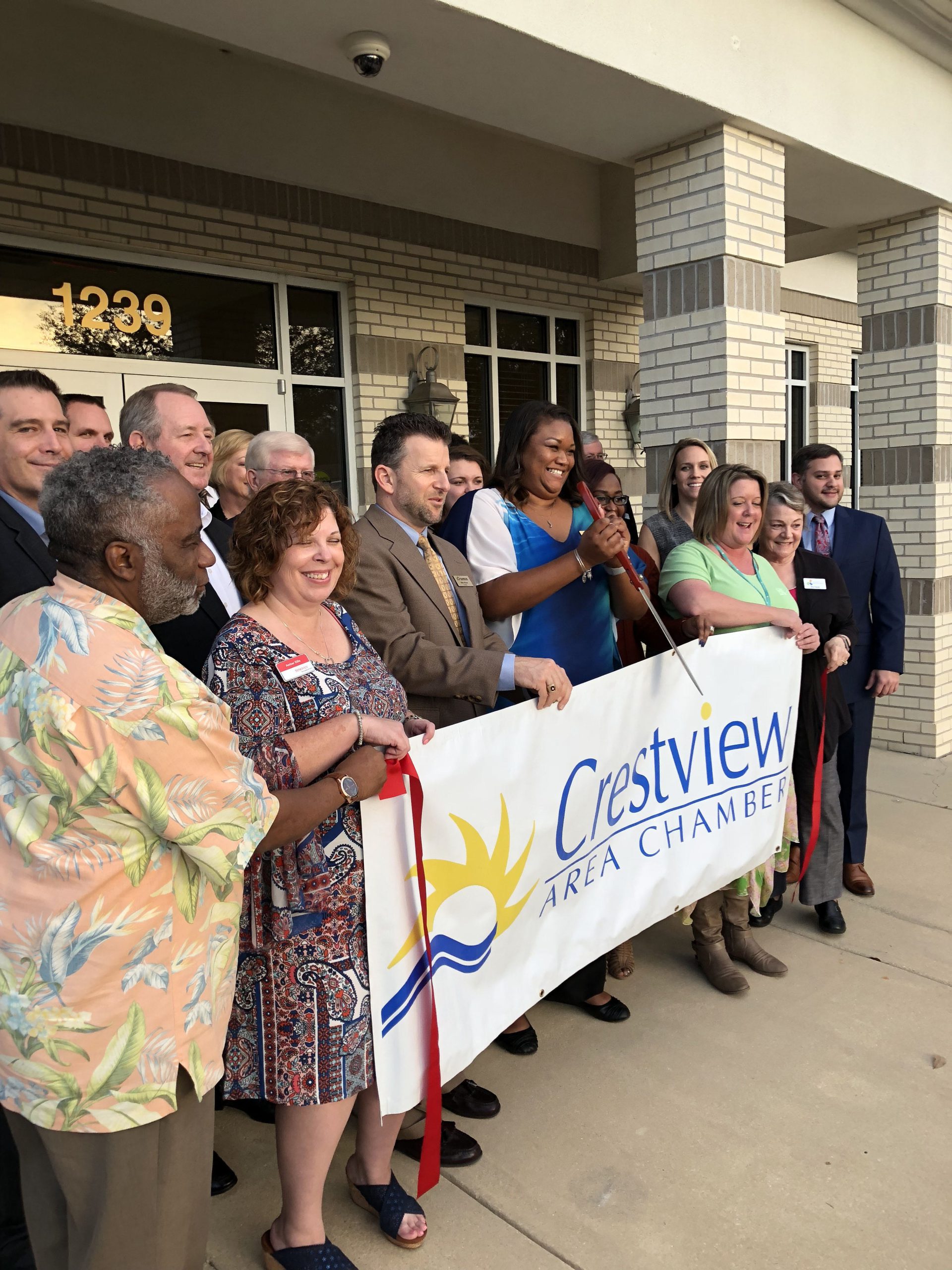 Candace Jones, Crestview Branch manager (center), cuts the ribbon to officially mark the opening of Army Aviation Center Federal Credit Unionís 22nd location recently in Crestview. [SPECIAL TO THE NEWS BULLETIN]