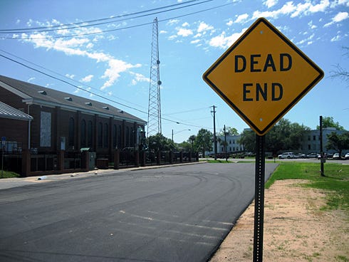 When Crestview Public Works crews resurfaced this section of Mapoles Street between U.S. Highway 90 and Hickory Avenue, some residents thought the city was performing work for First Baptist Church, left, or Burger King. But that's not the case, according to Crestview Public Services Director Wayne Steele.