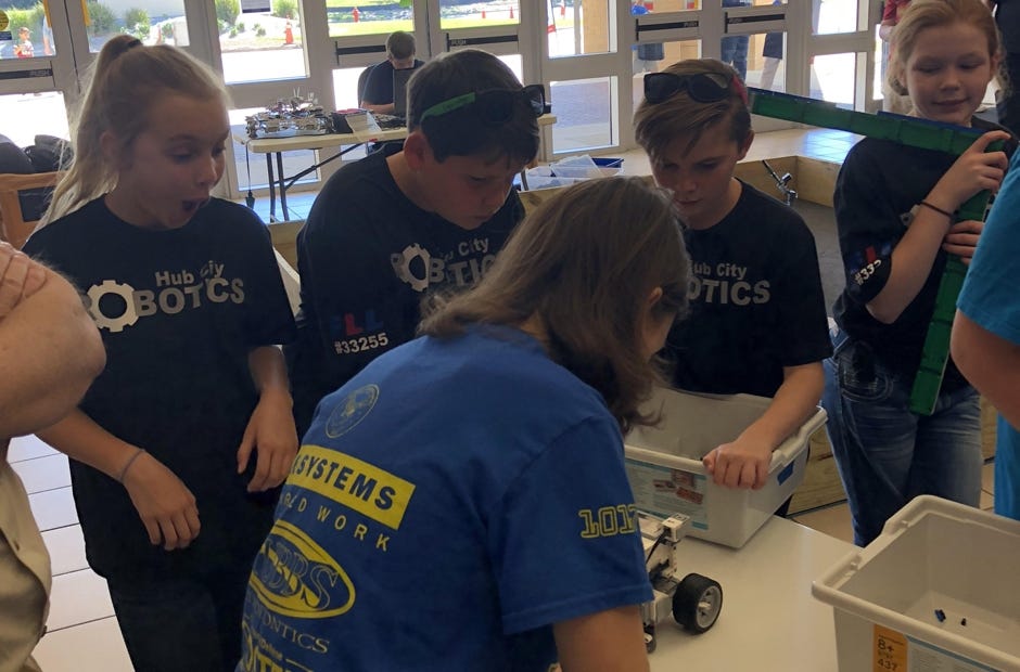 The Hub City Robotics team goes over the programming for one of their robots. The team won the FIRST LEGO League Regional Tournament in Panama City. [SPECIAL TO THE NEWS BULLETIN]
