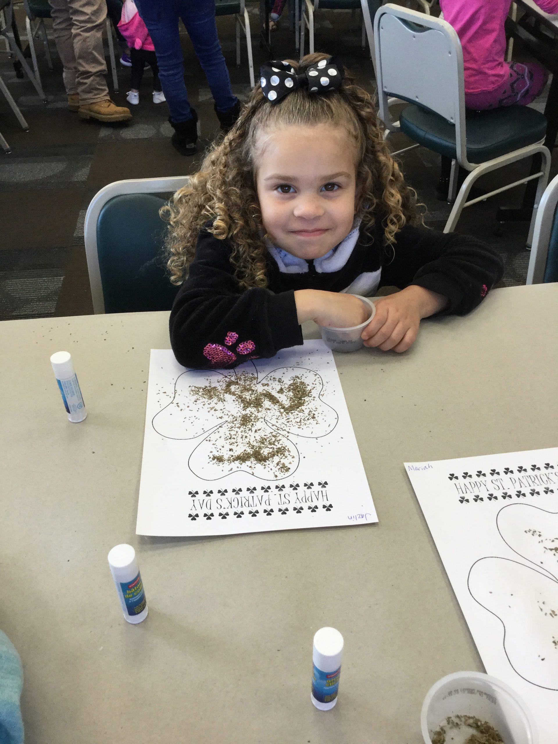 Jazlin Shoffner, age 5, of Crestview, makes her basil shamrock March 13 at the Crestview Public Library. She came to the Library with her Head Start class. [SPECIAL TO THE NEWS BULLETIN]